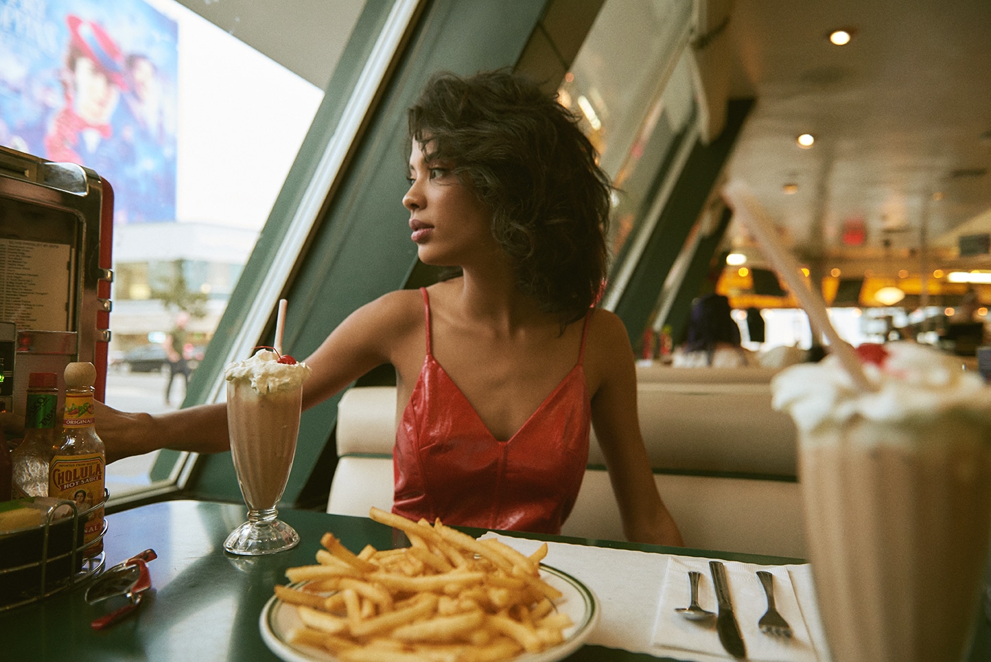 Diner editorial, red leather, milkshakes, cinematic light