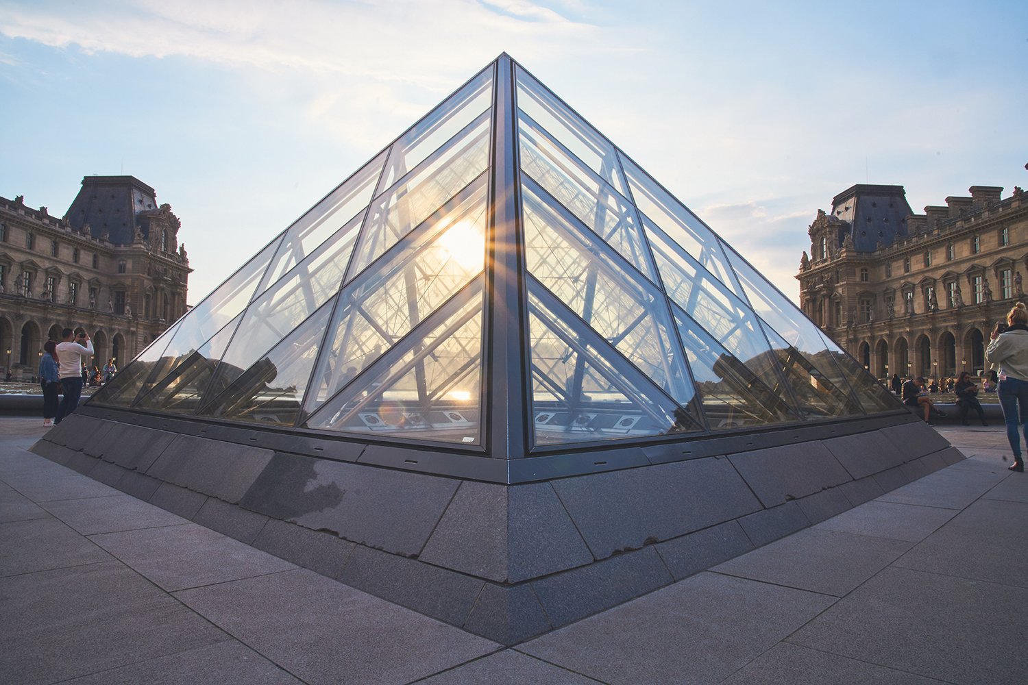 Louvre pyramid, sun through glass, courtyard