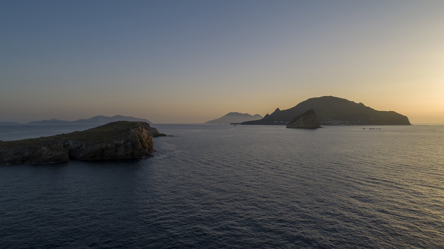 Italian coast from above, afternoon sun on water