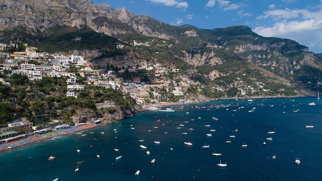 Aerial coastline, rocky cliffs meeting sea