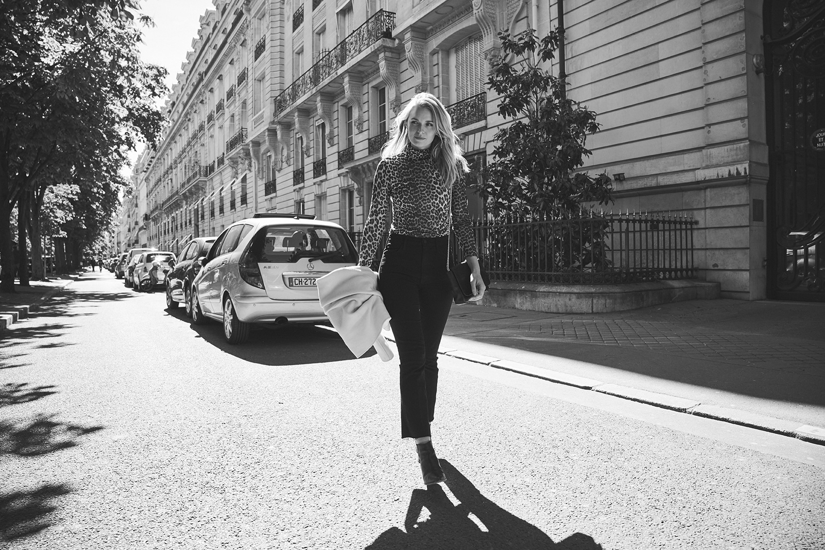 Paris street, black and white, leopard print top, Haussmann boulevard, strong shadows